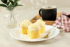 Cheese Chiffon Slice, Homemade Sponge Cake with Grated Cheese on Top. photo