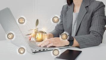AI. Artificial intelligence and machine learning concept. Businesswoman using laptop computer. photo