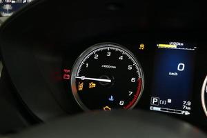 Operation warning lights and tachometer in the dashboard photo