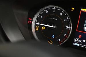 Operation warning lights and tachometer in the dashboard photo