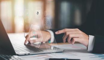 Businessman Audit documents, quality assessment management With a checklist, business document evaluation process, market data report analysis and consulting, and improvement of corporate strategy photo