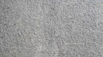 Close up macro view of rough grey stone surface. detailed nature background or pattern texture taken in natural environment. photo