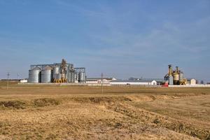 agro silos on agro-industrial complex and grain drying and seeds cleaning line. photo