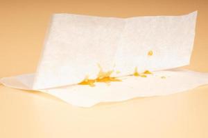 cannabis golden dab resin on paper from under the press photo