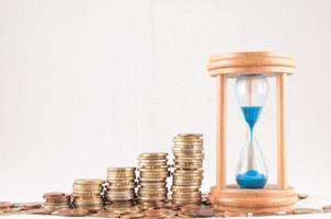 Hourglass and coins photo