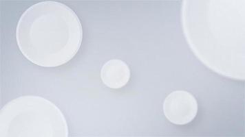 White circles in the form of pills bounce on a white background. Copy space white backdrop video