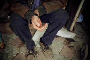 The extended arm of an elderly man asking for help or money. Poverty, donations, unemployment. photo