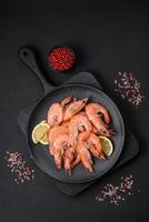 Tiger shrimp or langoustine boiled with spices and salt photo
