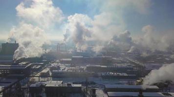 Factory smoke stack - Oil refinery, petrochemical or chemical plant in winter. View from the height