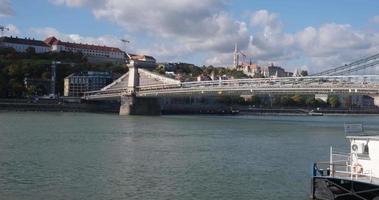 Chain Bridge over the Danube in Budapest with landmark on the waterfront video