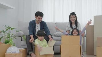 New home for family. activities together during the holidays. Parents and children are having activity on vacant time. weekend, enjoyment, happy family, togetherness, feel good. Move home video