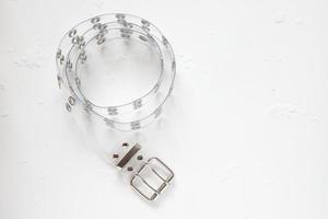 Transparent plastic belt with silver decor, clothes accessories photo