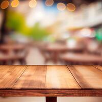 Wooden table top in cafe blurred bokeh background - image photo