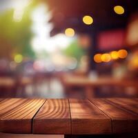 Wooden table top in cafe blurred bokeh background - image photo