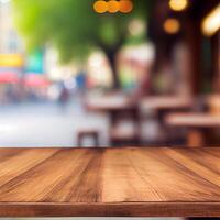 Wooden table top in cafe blurred bokeh background - image photo