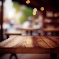 Wooden table top in cafe blurred bokeh background - image photo