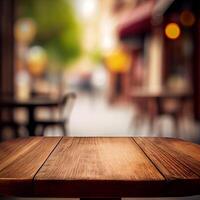 Wooden table top in cafe blurred bokeh background - image photo