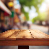 Wooden table top in cafe blurred bokeh background - image photo
