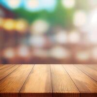 Wooden table top in cafe blurred bokeh background - image photo