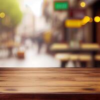 Wooden table top in cafe blurred bokeh background - image photo