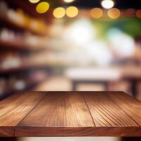 Wooden table top in cafe blurred bokeh background - image photo