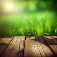 Wood table top close up, beautiful texture of green meadow grass, abstract blur natural bokeh - image photo