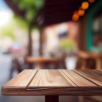 Wooden table top in cafe blurred bokeh background - image photo