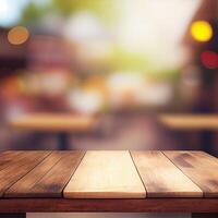 Wooden table top in cafe blurred bokeh background - image photo