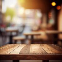 Wooden table top in cafe blurred bokeh background - image photo