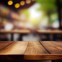 Wooden table top in cafe blurred bokeh background - image photo