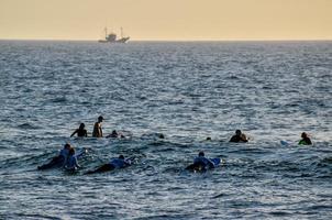 Surfers in the ocean photo