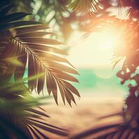 Blur beautiful nature green palm leaf on tropical beach with bokeh sun light flare wave abstract background. Summer vacation and business travel concept space - image photo