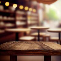 Wooden table top in cafe blurred bokeh background - image photo