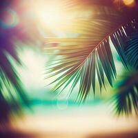 Blur beautiful nature green palm leaf on tropical beach with bokeh sun light flare wave abstract background. Summer vacation and business travel concept space - image photo