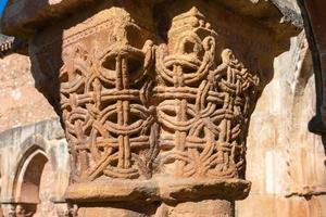 Corinthian detail of Romanesque stone column photo