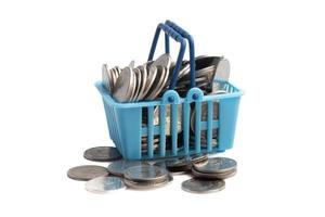 Basket of coins on white background.Finance, business concept, copy space. photo