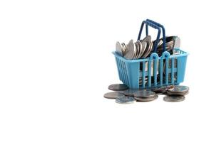 Basket of coins on white background.Finance, business concept, copy space. photo