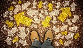 Yellow Leather Shoes and Many Chalky Arrows in Various Directions - Chaos Concept photo