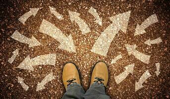 Yellow Leather Shoes and Many Chalky Arrows in Various Directions - Chaos Concept photo