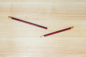 A photo of pencils isolated on wooden background, after some edits.