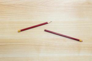 A photo of pencils isolated on wooden background, after some edits.