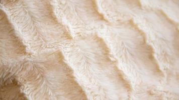 A close up of a white fur blanket photo