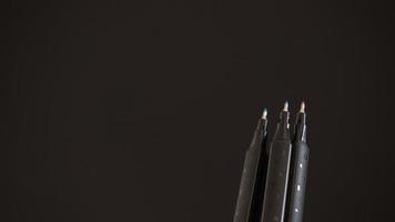 Close-up of pencils on black background with copy space photo