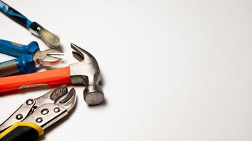Assorted construction tools on a white background. Copy space for text.