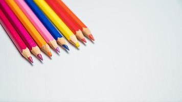 Colorful pencils on white background. Back to school concept. photo