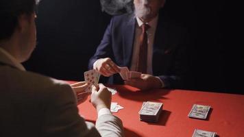 Two businessmen gambling.  Gambling and nightlife. Businessmen gamble and smoke among themselves. video