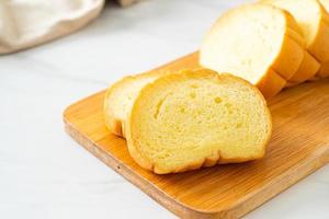 potatoes bread sliced on wood board photo