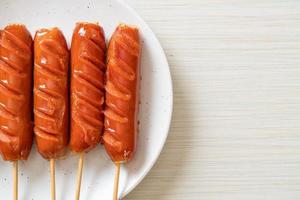 fried sausage skewer on plate photo