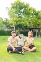 Asian couple love with dog photo