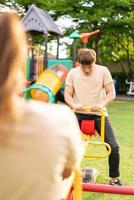 Asian couple love play seesaw photo